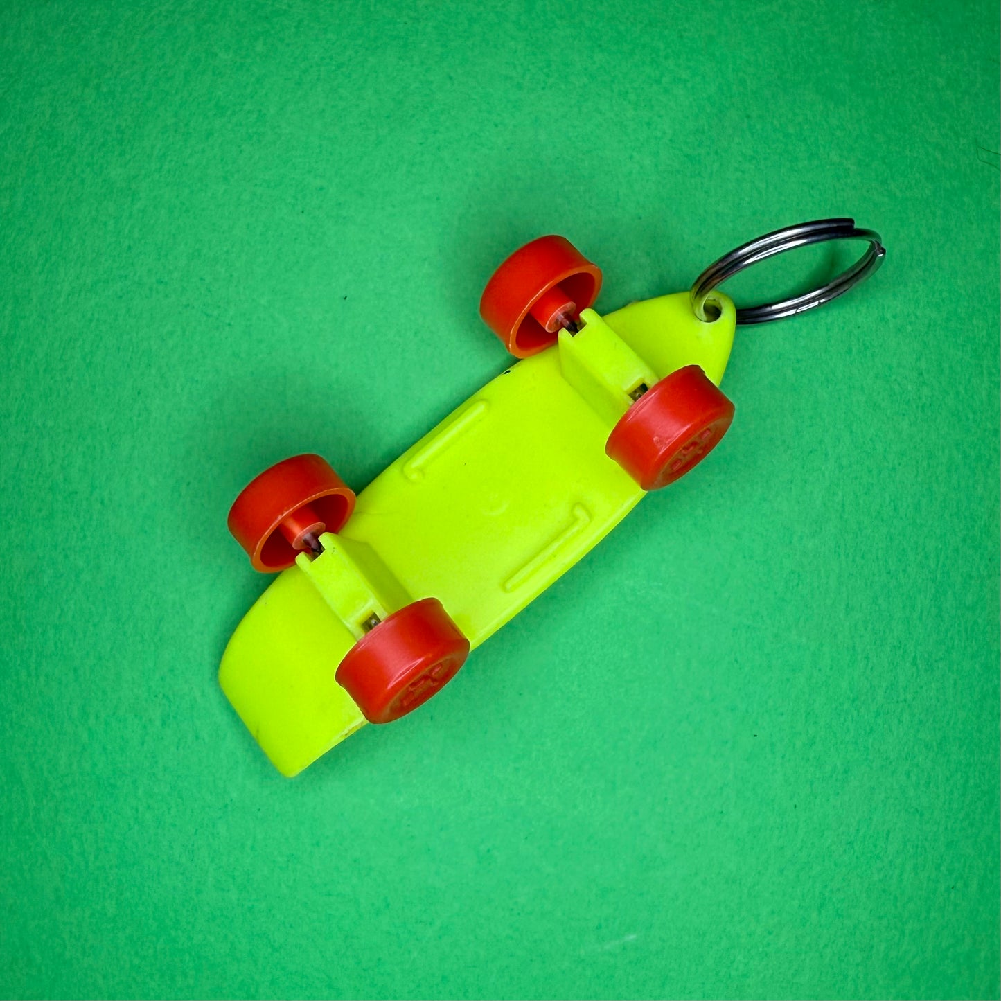 Retro plastic skateboard yellow neon keyring