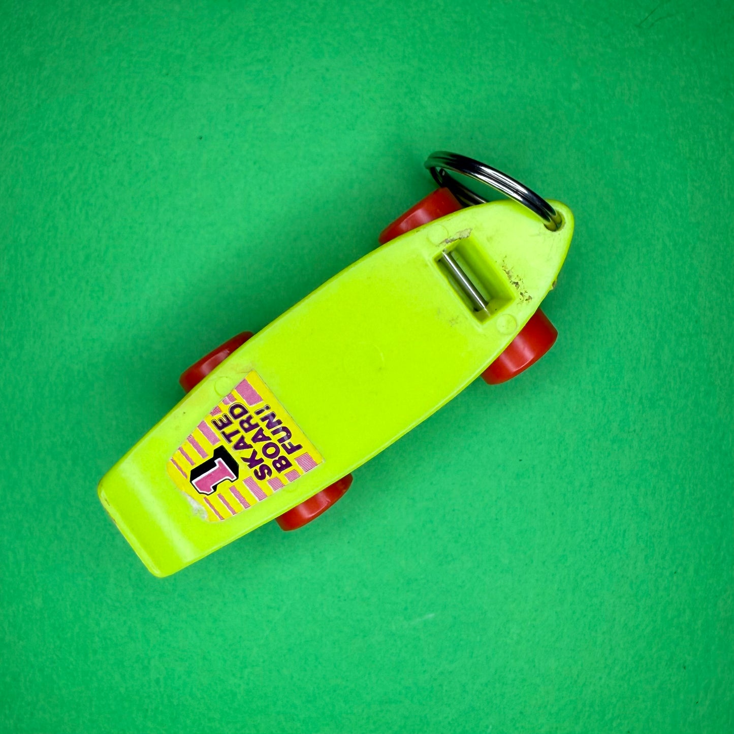Retro plastic skateboard yellow neon keyring