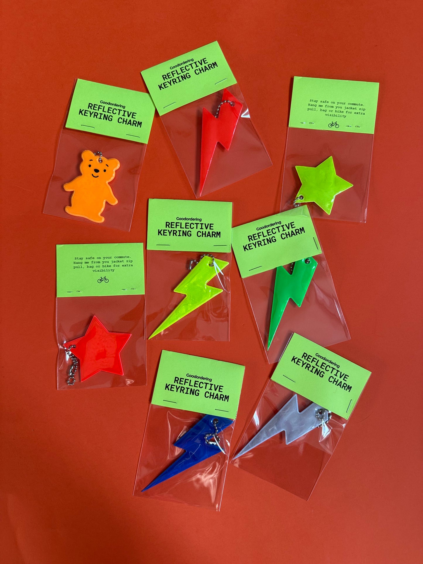 Neon orange teddy bear light reflector charm