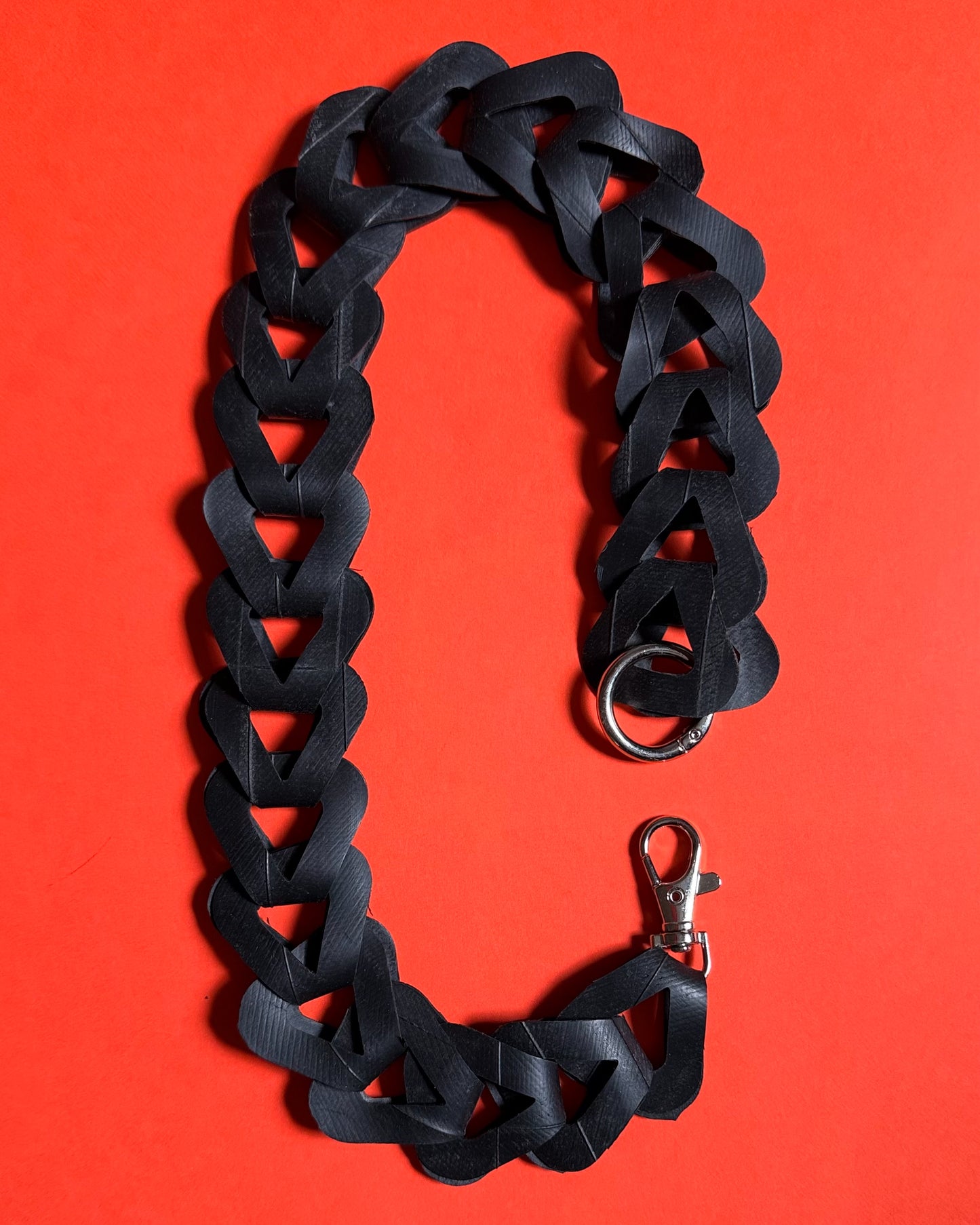 Upcycled inner tube pocket strap