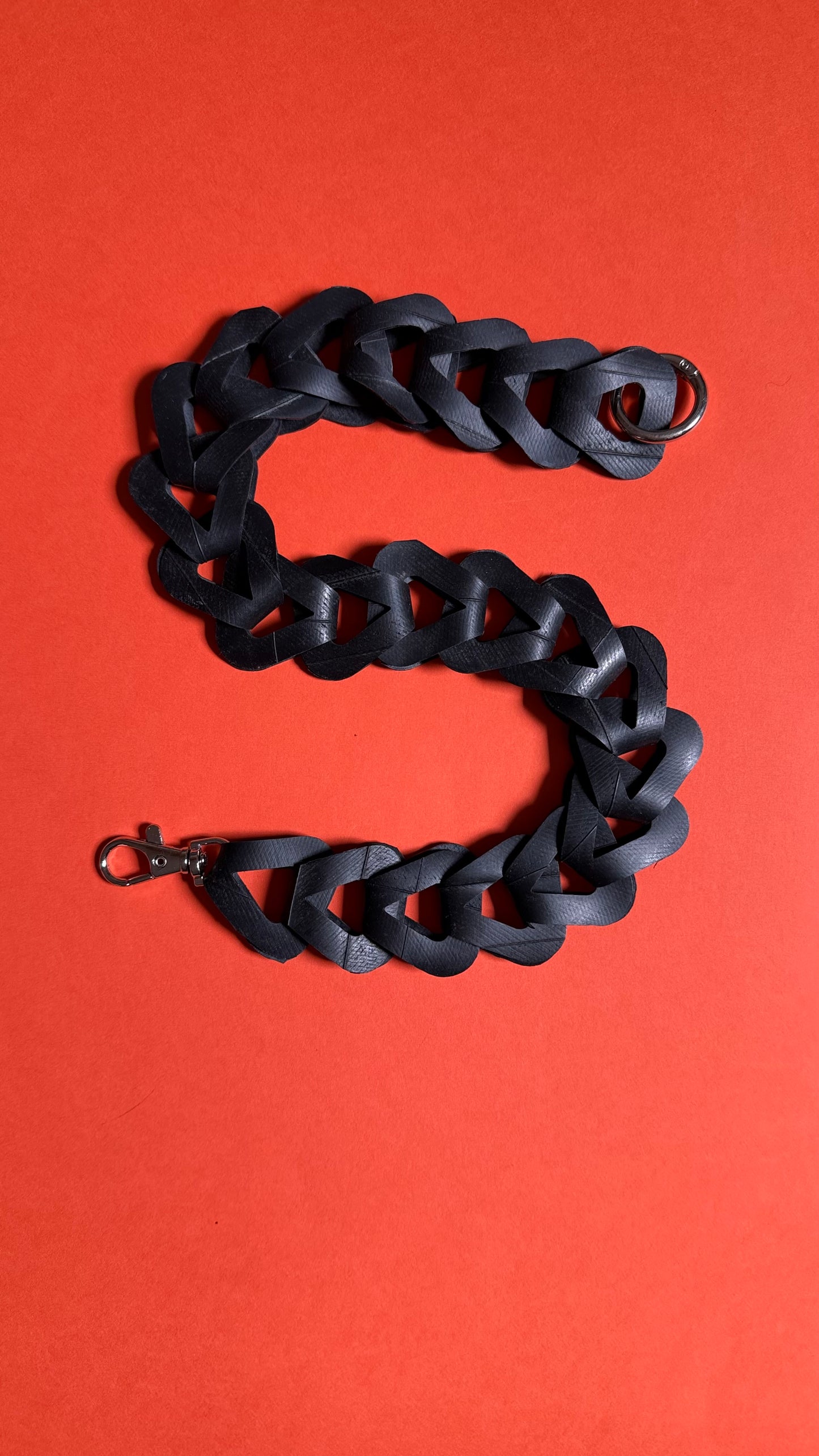 Upcycled inner tube pocket strap