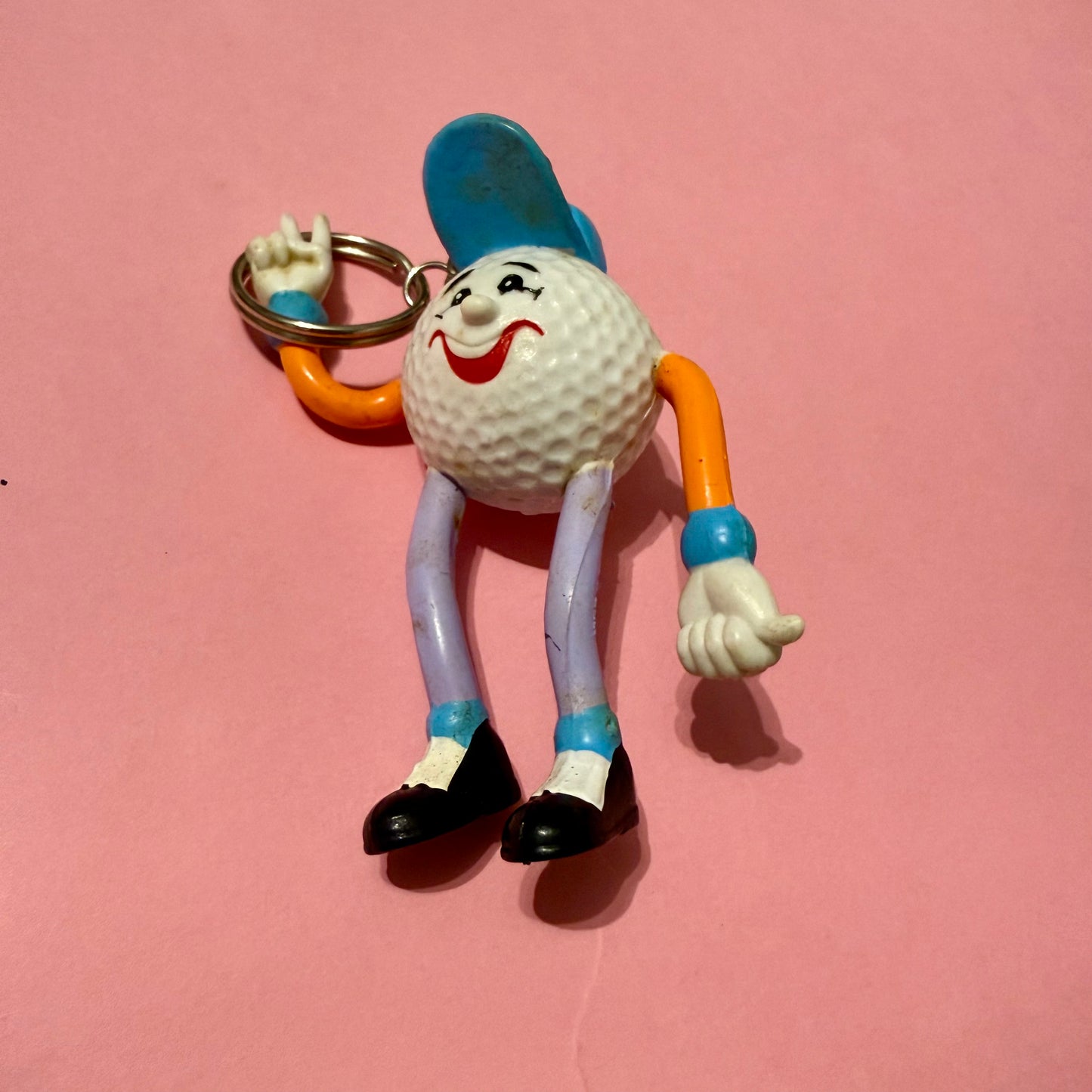 Retro plastic 80s golf ball man keyring