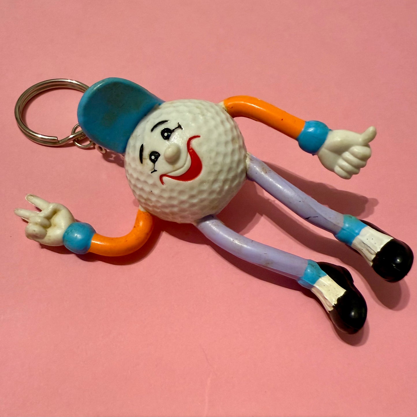 Retro plastic 80s golf ball man keyring