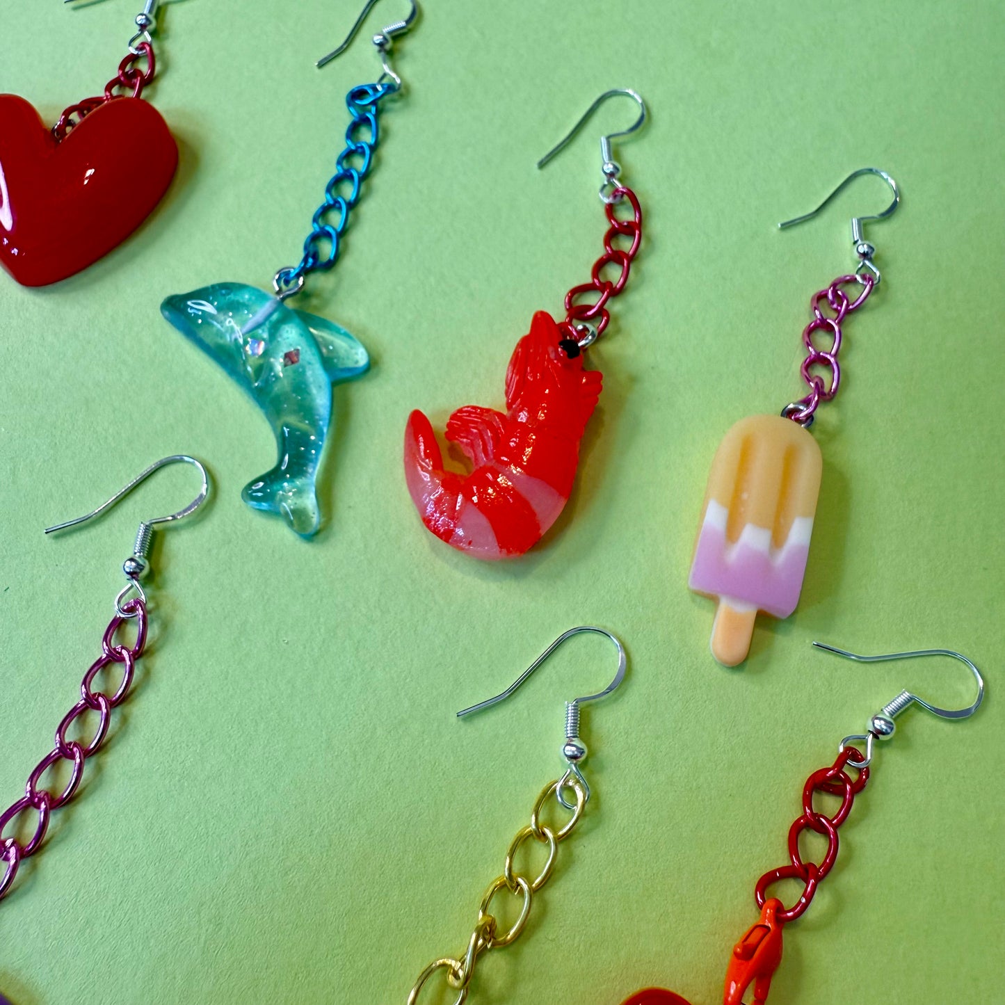 Playful motif drop chain earrings
