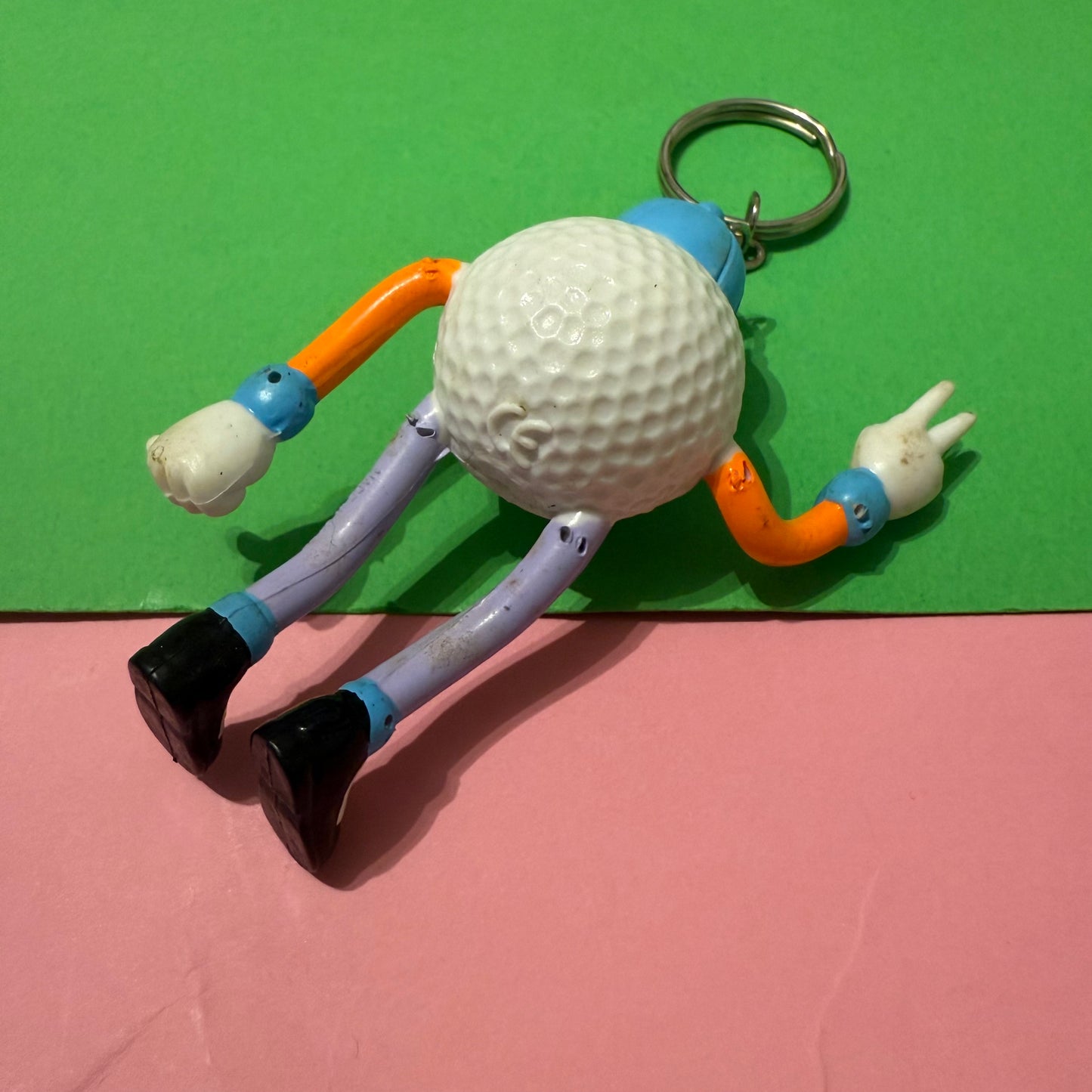 Retro plastic 80s golf ball man keyring
