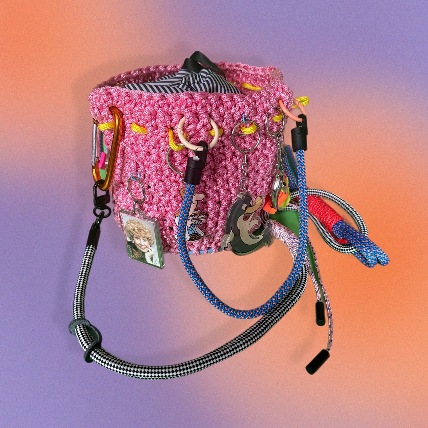 Crocheted paracord bucket bag with charms