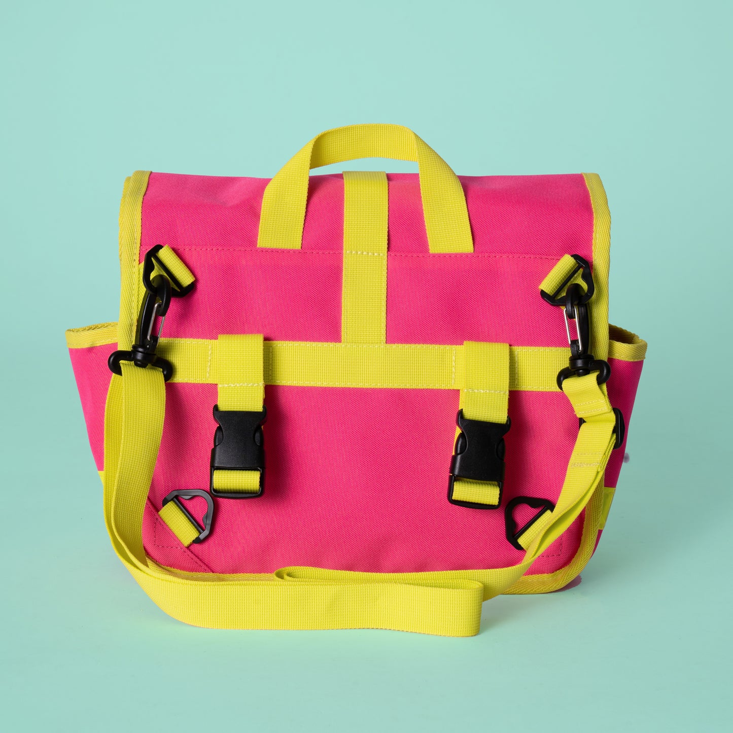 Neon pink and yellow roll top handlebar bag shoulder bag