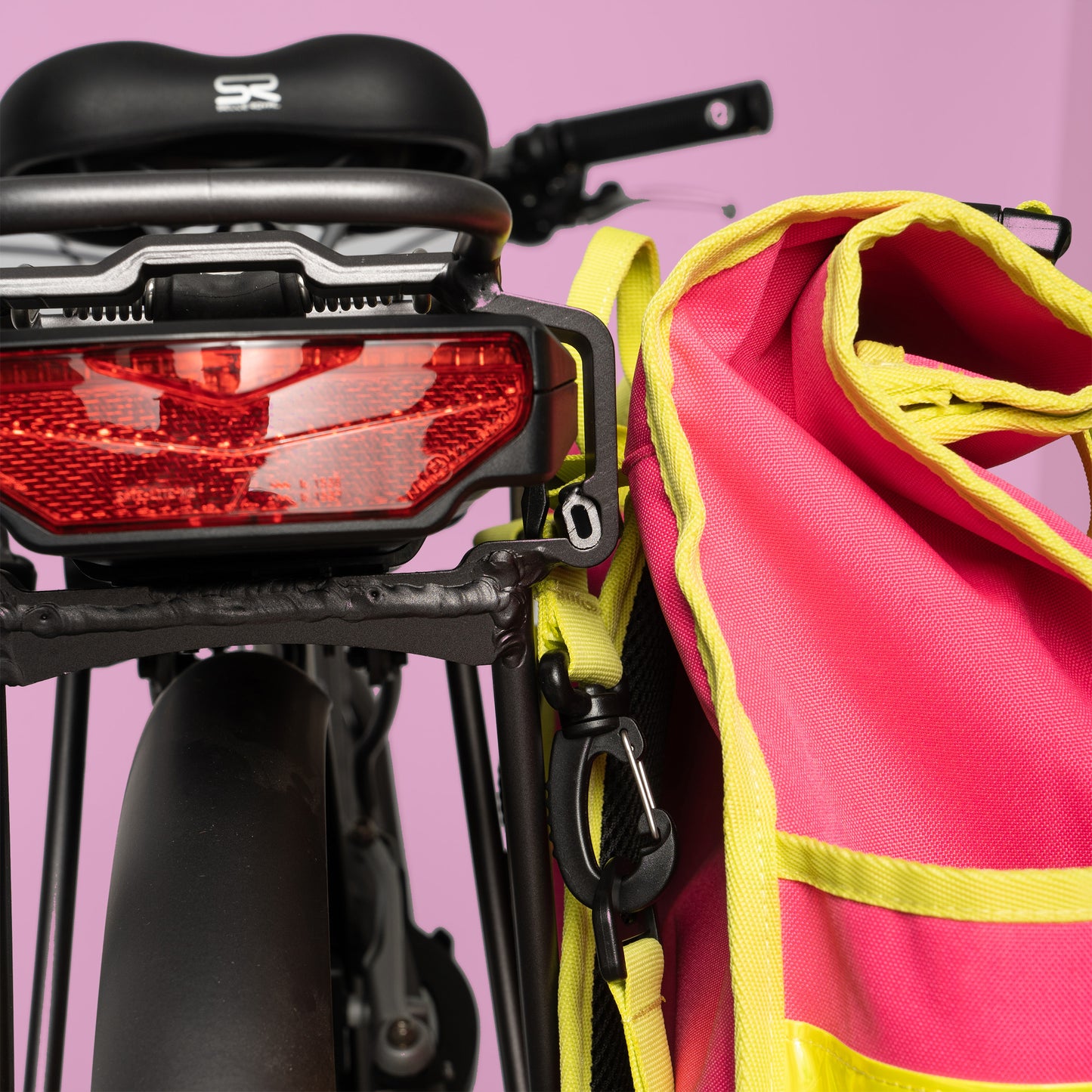 Neon pink rolltop backpack pannier bike bag