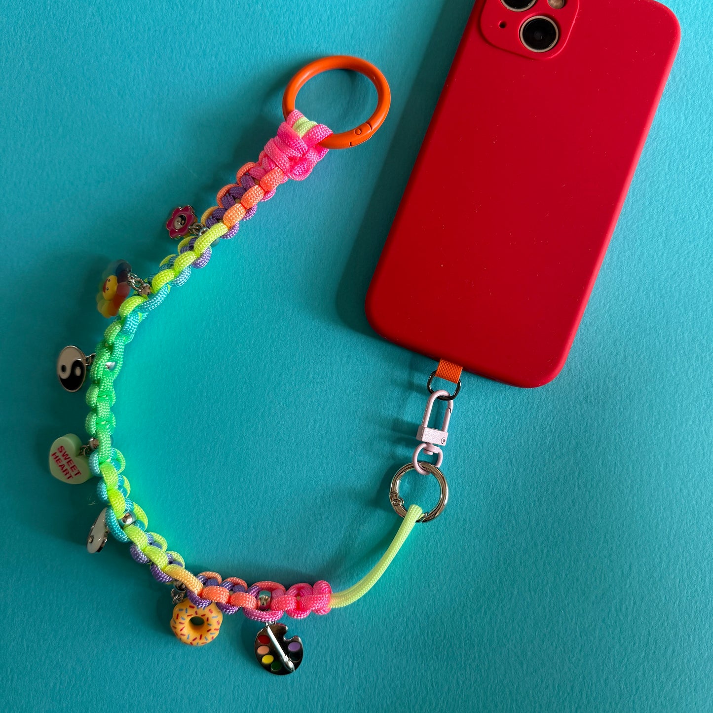 Phone wristler strap with charms