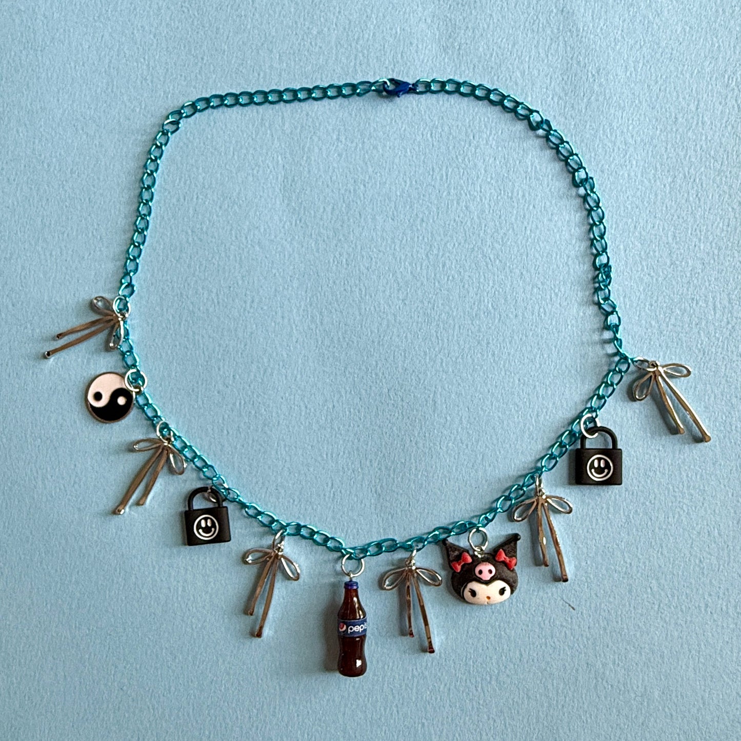 Emo bue charm necklace