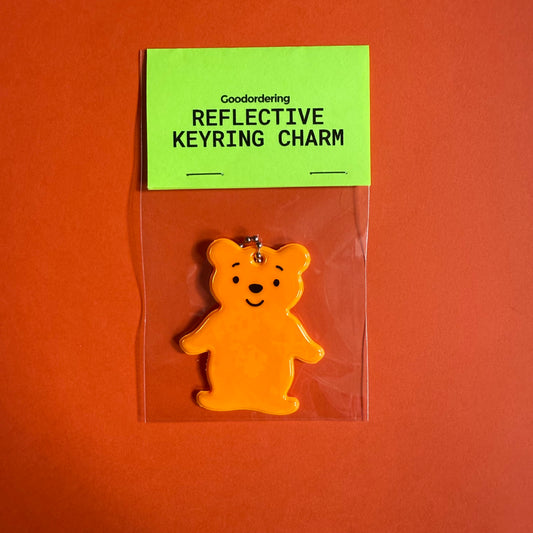 Neon orange teddy bear light reflector charm