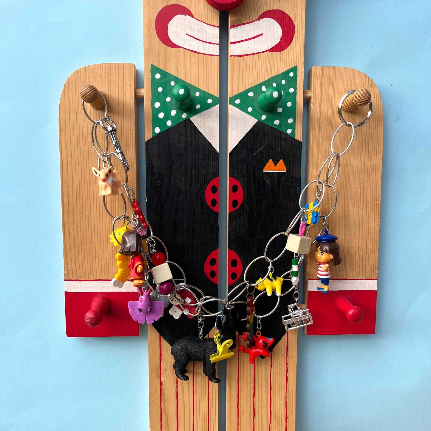 Goodordering Clown wood prop with bag charm chain displayed on it 