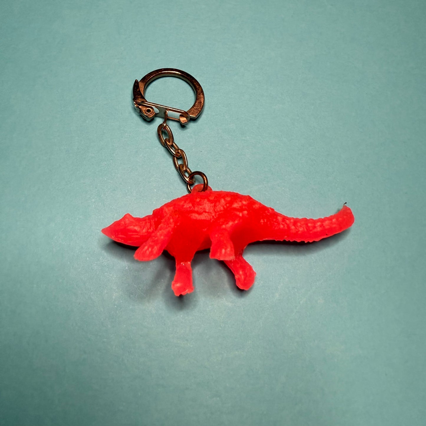 Neon 80s mini dinosaur charm keyring