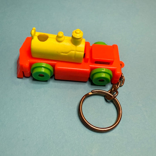 Neon 80s mini train engine charm keyring