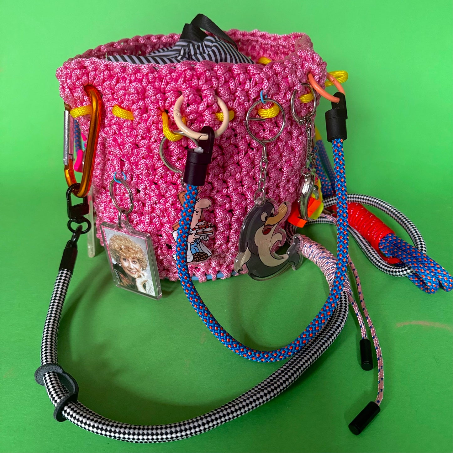 Crocheted paracord bucket bag with charms