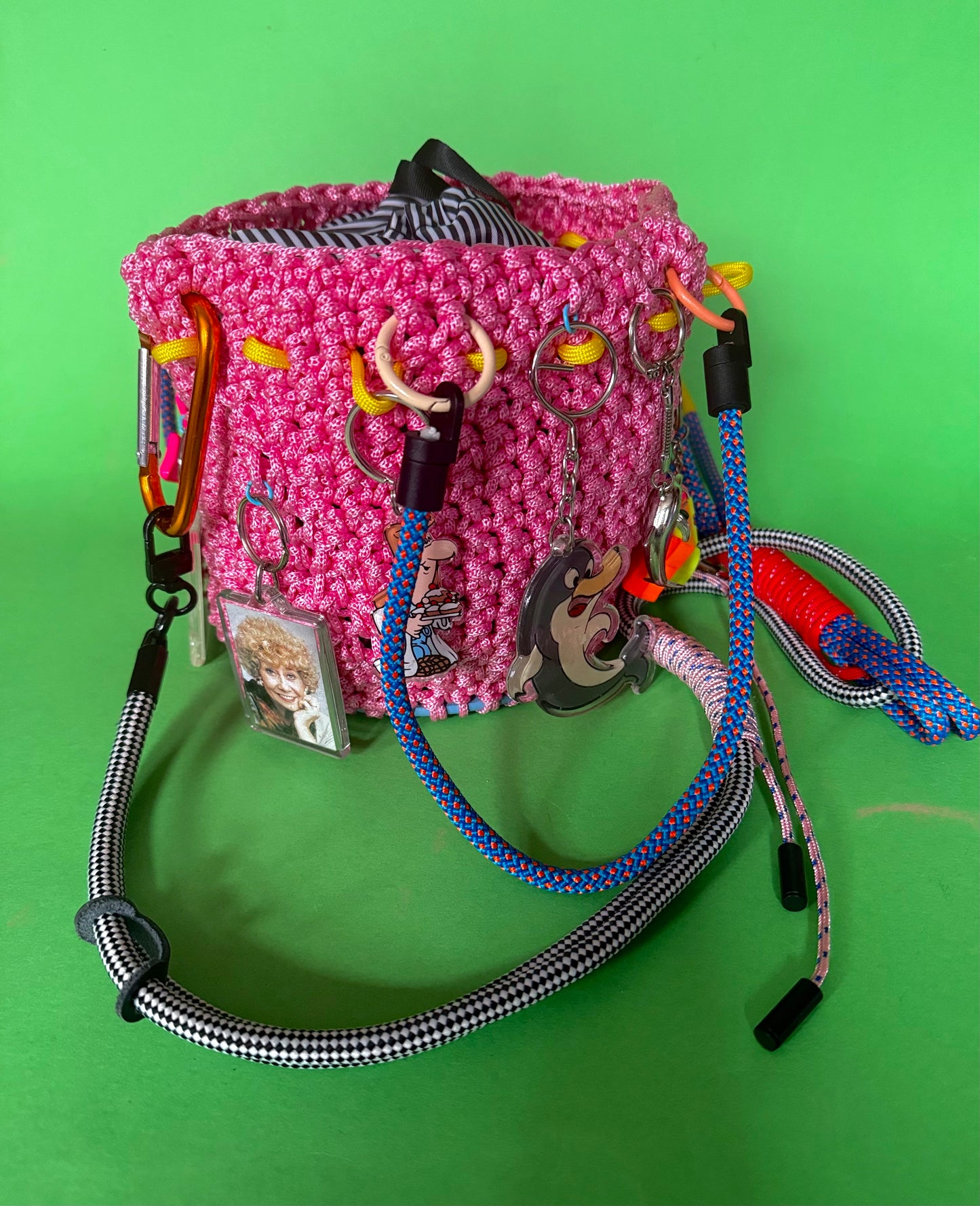 Crocheted paracord bucket bag with charms