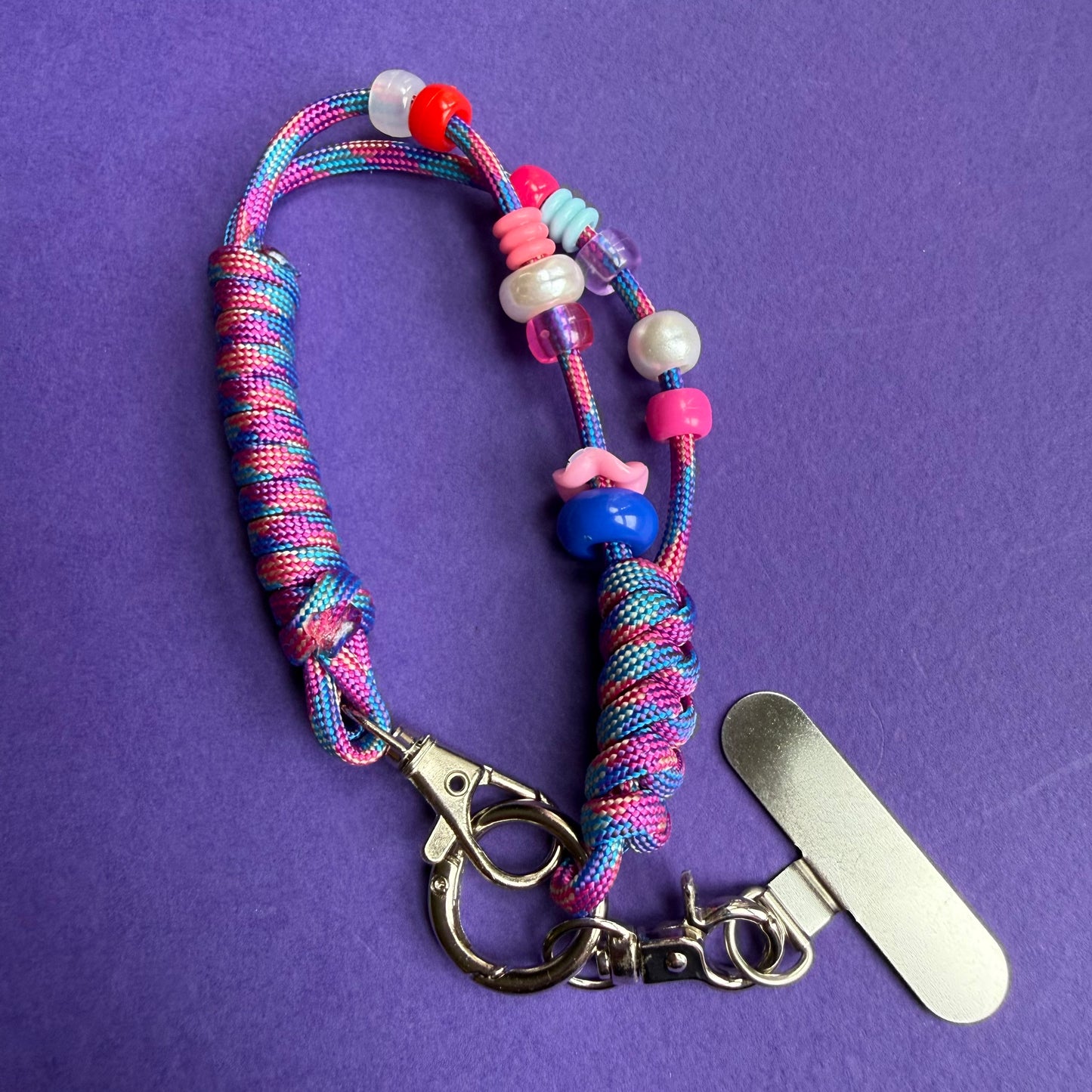 Phone wrist strap with fidget beads