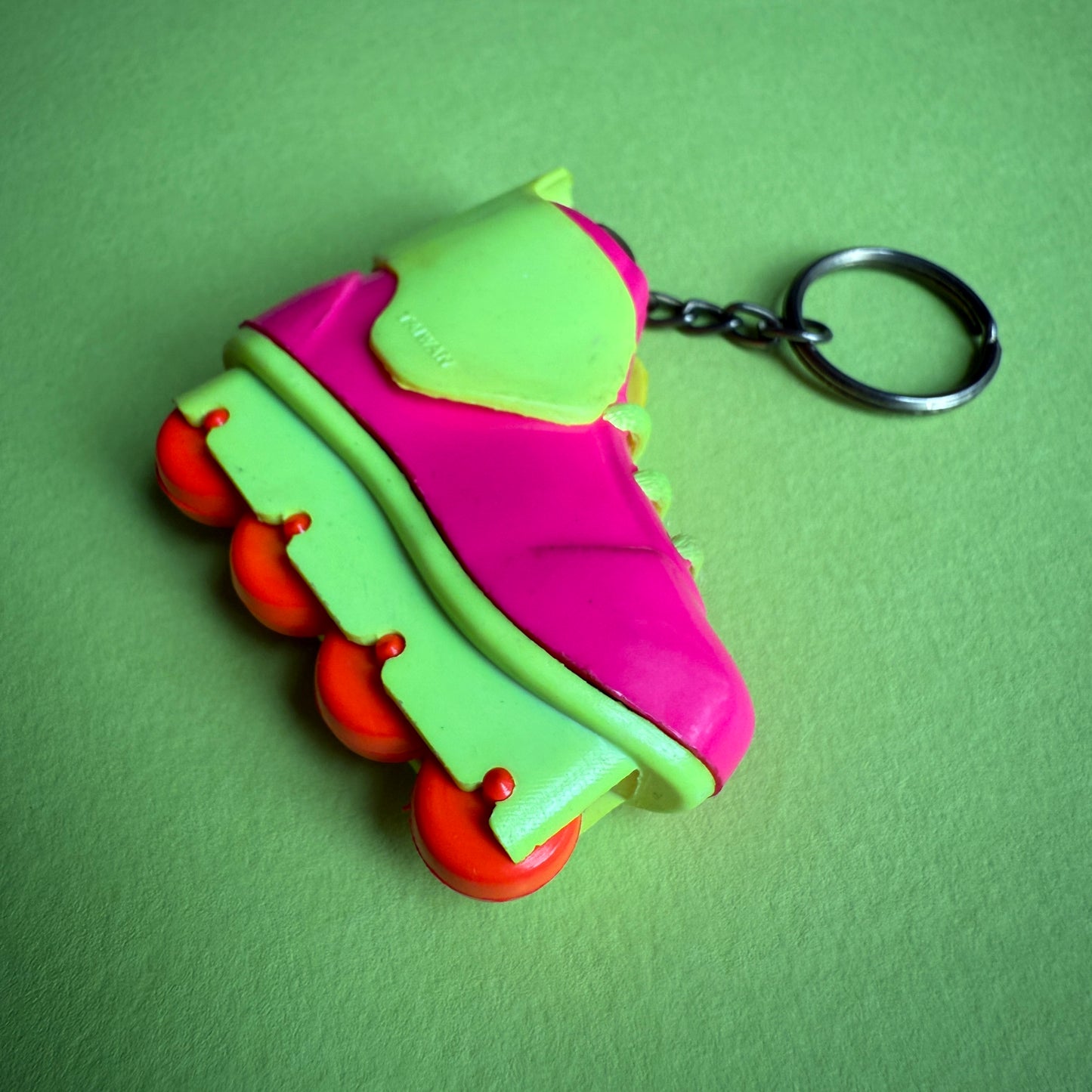 Neon 80s pink rollerblade charm