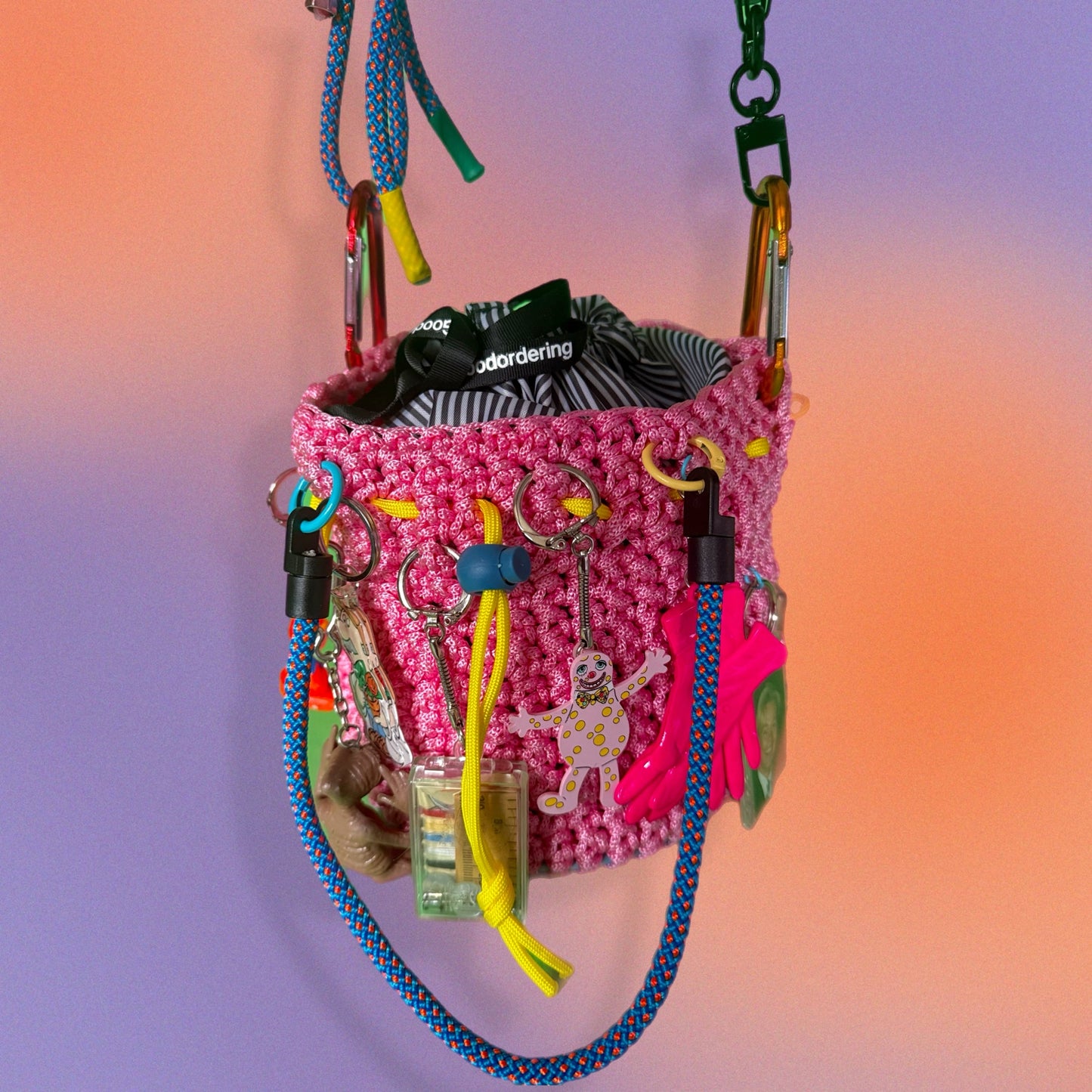 Crocheted paracord bucket bag with charms