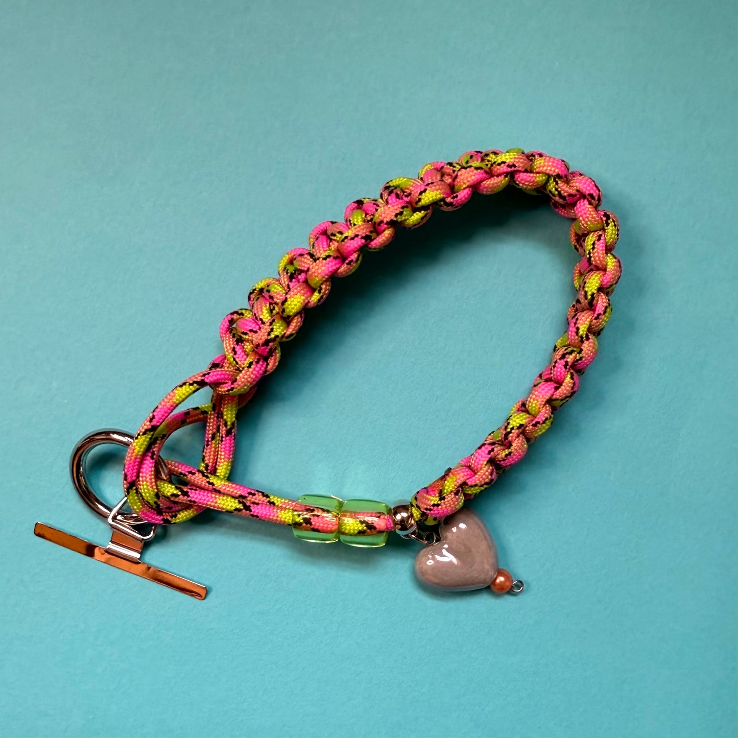 Phone wristlet strap with heart bead