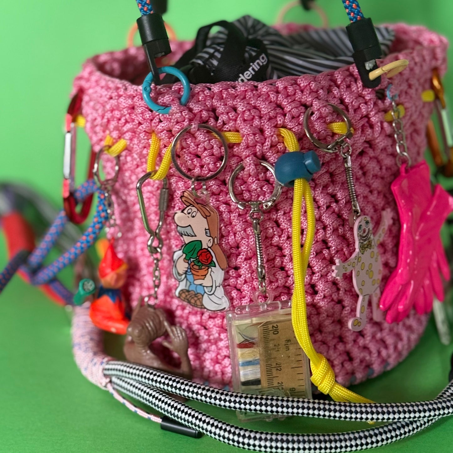 Crocheted paracord bucket bag with charms