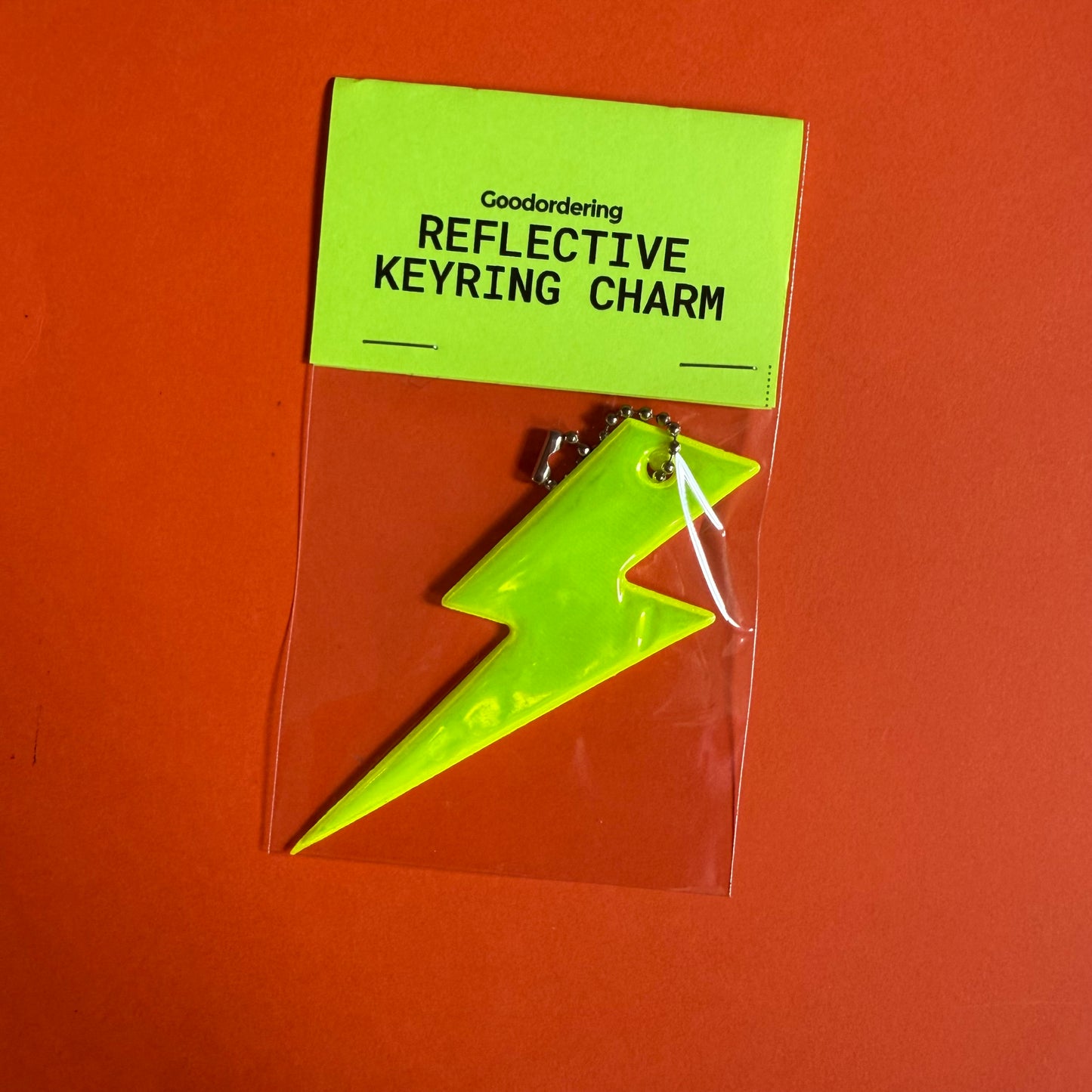 Neon bolt light reflector charm