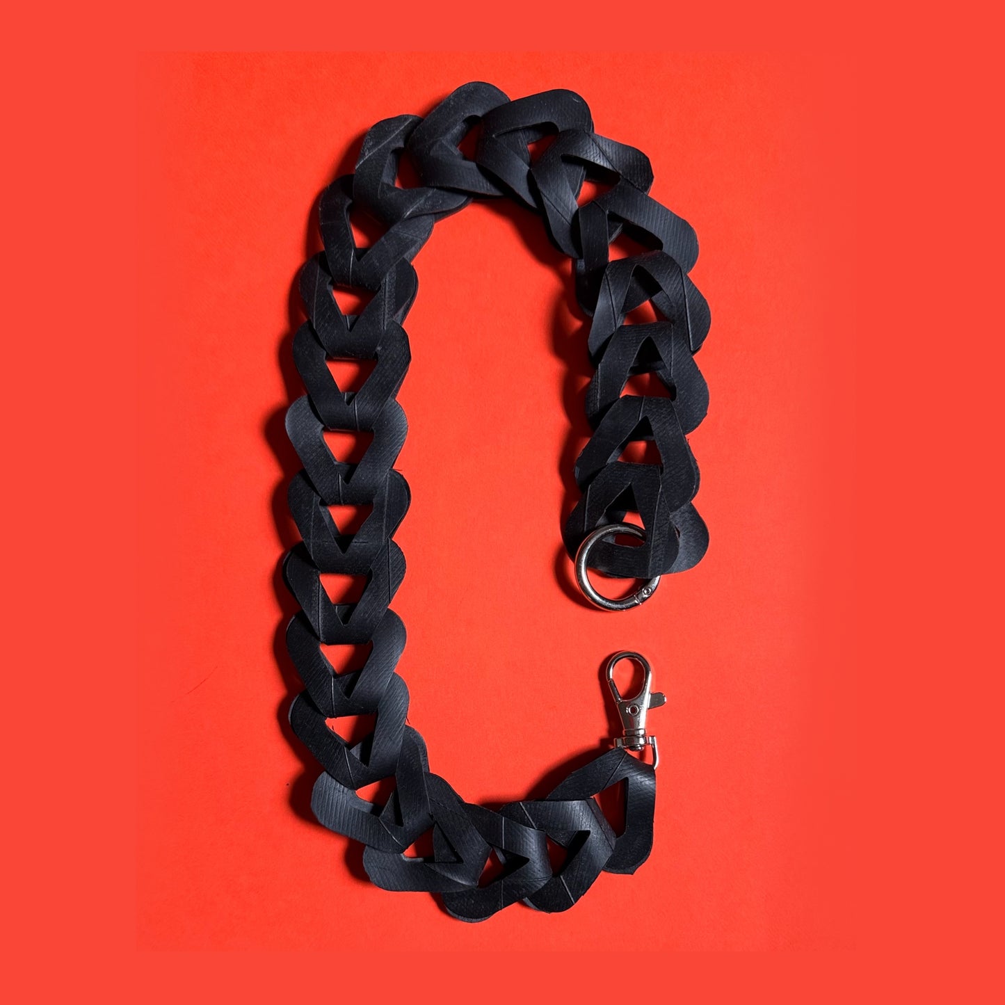 Upcycled inner tube pocket strap
