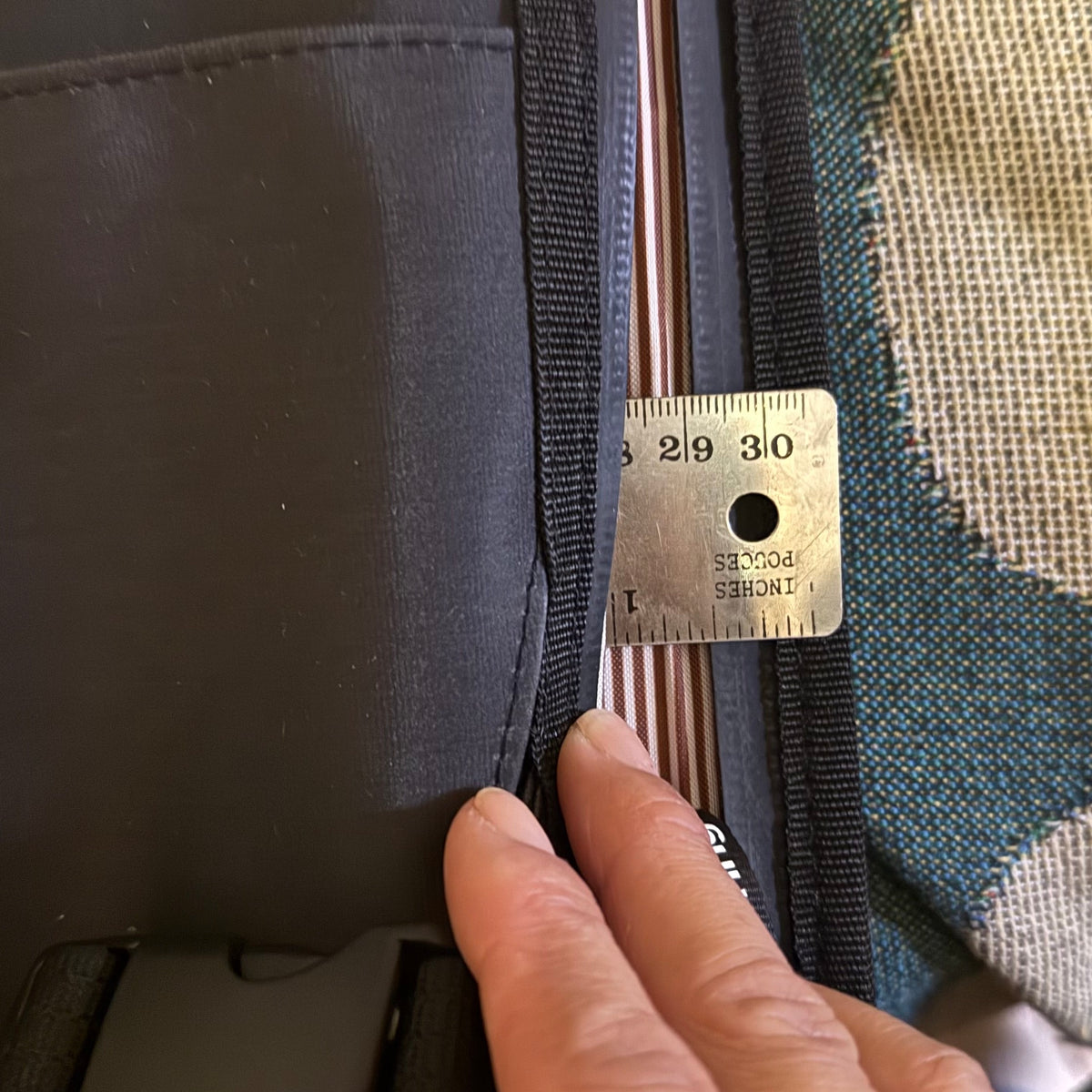 Laptop pocket Expandable black rolltop backpack showing rolled and unrolled capacity