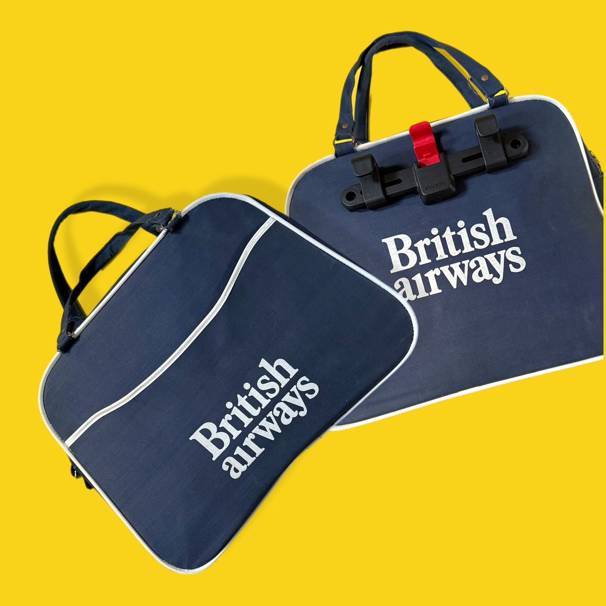 Two navy blue car mats with 'British Airways' branding on a yellow background