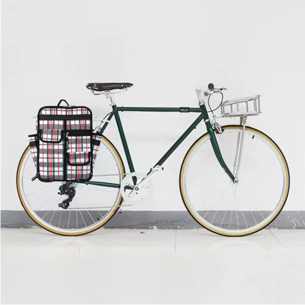 Green bicycle with a plaid bag on a white background klik-fix-tartan-backpack-pannier