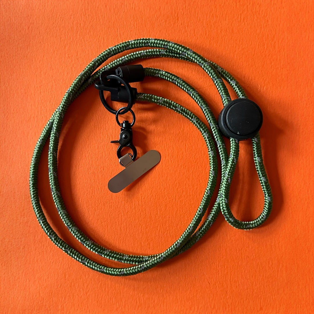 Strong 6mm army green phone strap made from reflective nylon paracord. Adjustable phone lanyard for hands-free carrying, travel, cycling and everyday use.