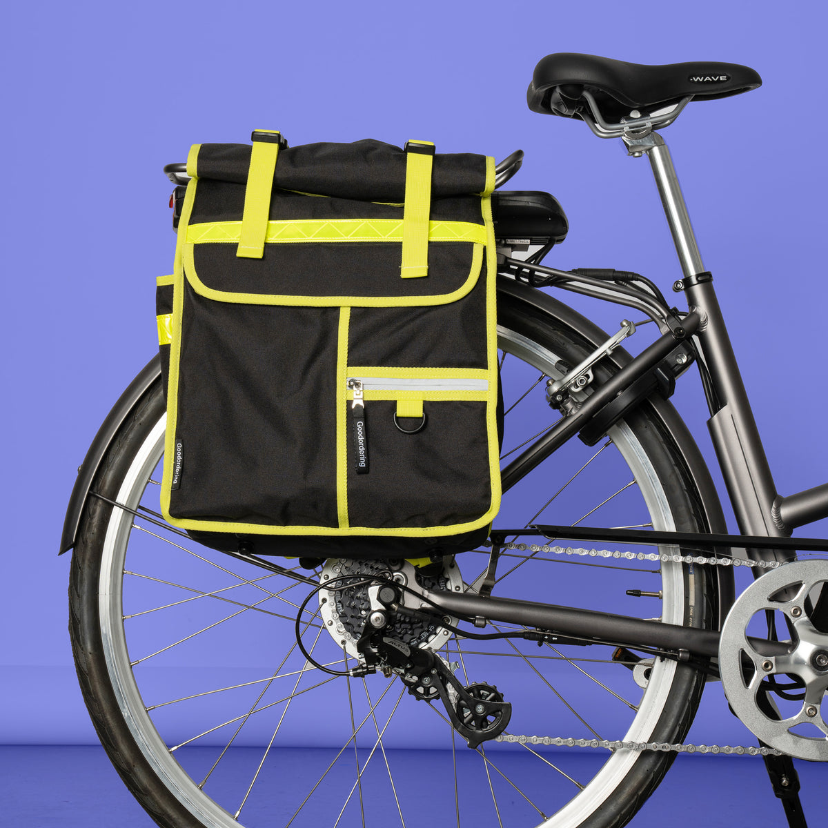 Neon rolltop backpack black pannier bike bag - Goodordering Black rolltop backpack attached to a bicycle rear pannier rack
